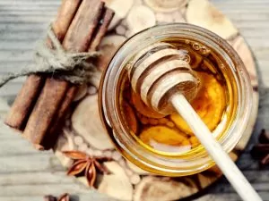Golden honey with honeystick. cinnamon and anise stars