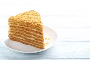 Homemade honey cake on white wooden table
